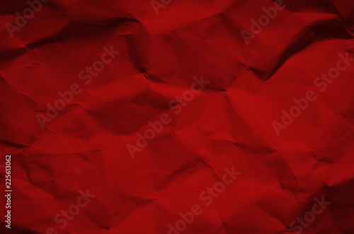 Red and vintage background by crumpled paper texture and free space for text.