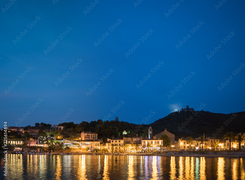 Beautiful coast of Colliure village at night, Languedoc Roussillon, Oriental Pyrinees. Collioure is a coastal village in the south of France.