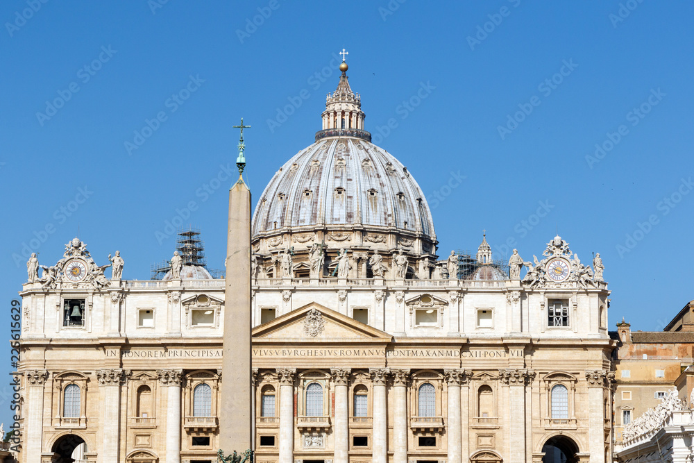 St. Peter's Basilica, Vatican City, Rome, Italy; in horizontal orientation with copy space for text and a clear blue sky background