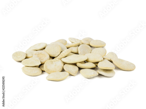 Small bunch of pumpkin seeds isolated on white background.