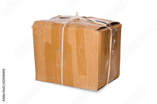 Old cardboard box tied with a rope