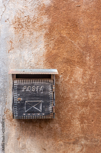 Old Italian mailbox on wall in Tuscania, Italy