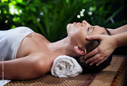 Canvas Print portrait of young beautiful woman in spa environment.