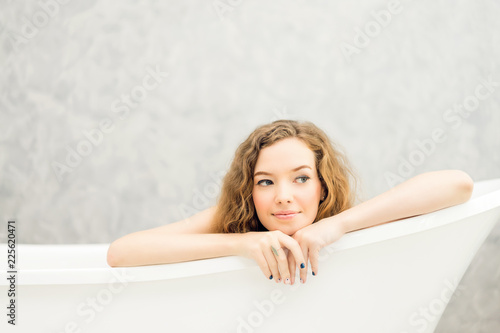 Woman is soaking in the bathtub.Young woman relaxing in bath.beautiful woman lying in bathtub.