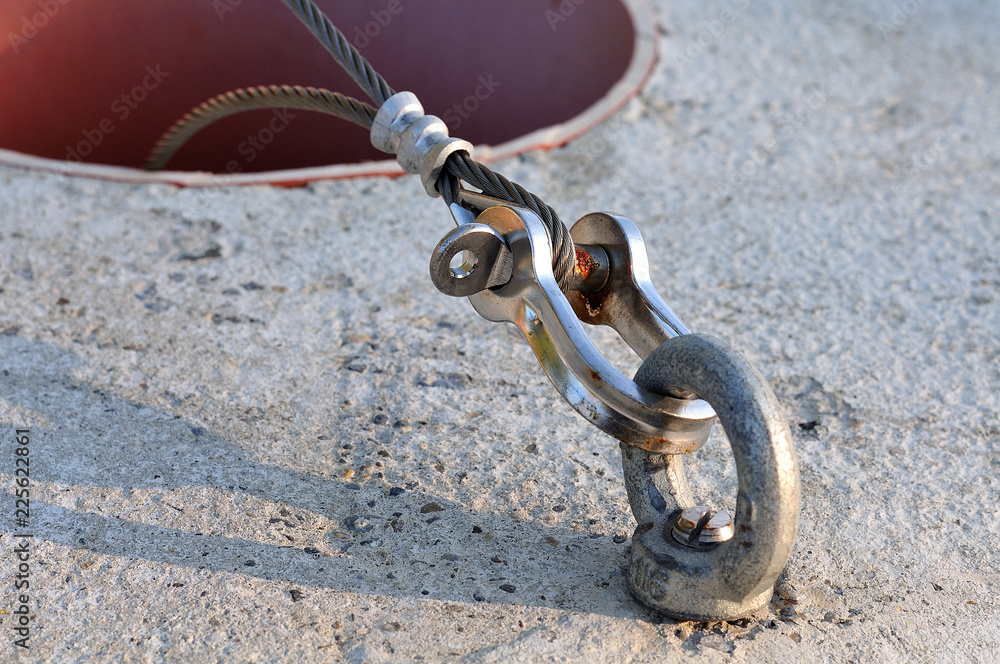 wire rope connected to concrete block with a shackle Stock Photo Adobe Stock