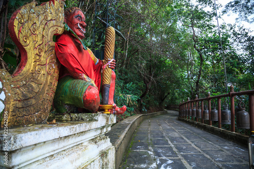 Giant Gate Guardian at temple entrance  to Wat Phra That Doi Tung, Chiang Rai, Thailand. Thai Travel Tourism. photo