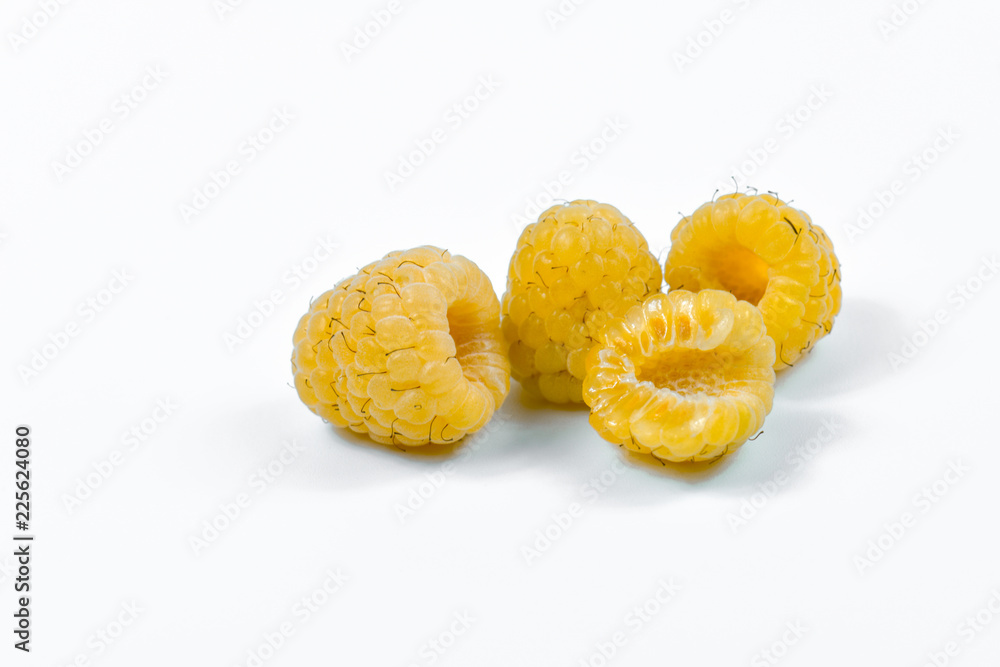 Set of yellow raspberry berry fruits on white background. Set of yellow raspberry berry fruits on white background.