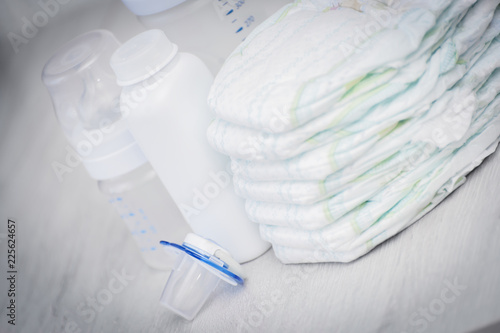 Diapers, talc powder, milk bottle