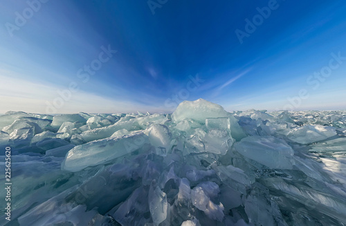 Transparent blocks hummocks of the Baikal ice, panorama