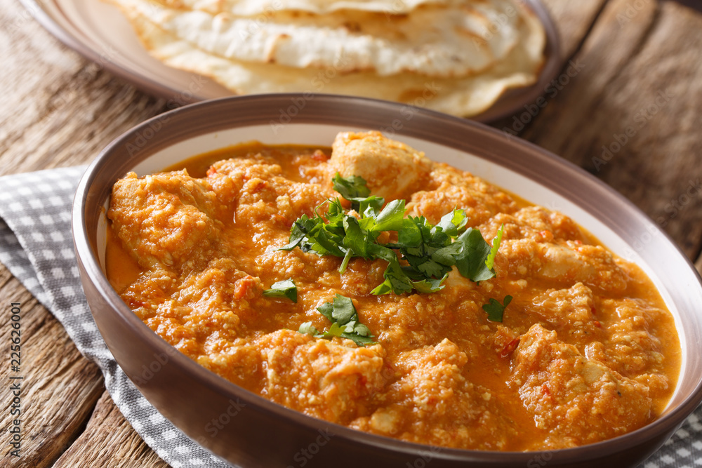 The chicken changezi of slow cooking complete with rich ingredients cream, cashew nuts, ghee, and the likes close-up on a plate. horizontal The chicken changezi of slow cooking complete with rich ingredients cream, cashew nuts, ghee, and the likes close-up on a plate. horizontal