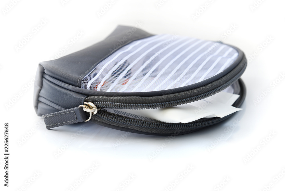The bag for cosmetics with face cream on a light background The bag for cosmetics with face cream on a light background