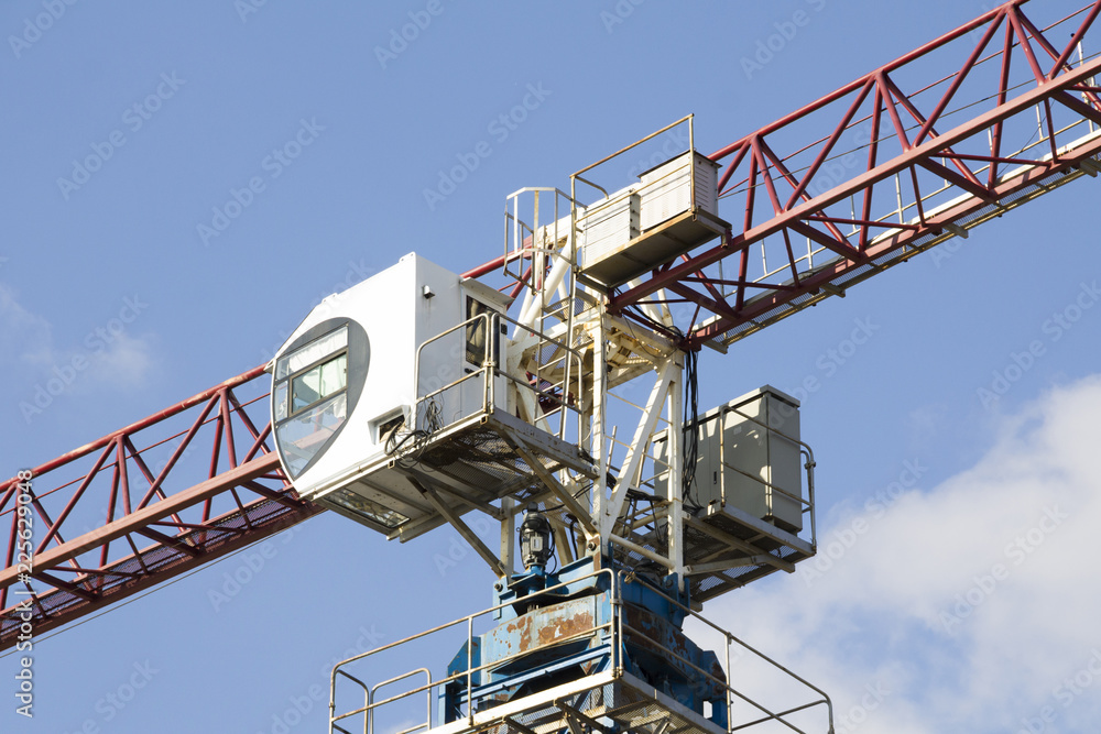 Construction. Tower crane on the sky background. Crane