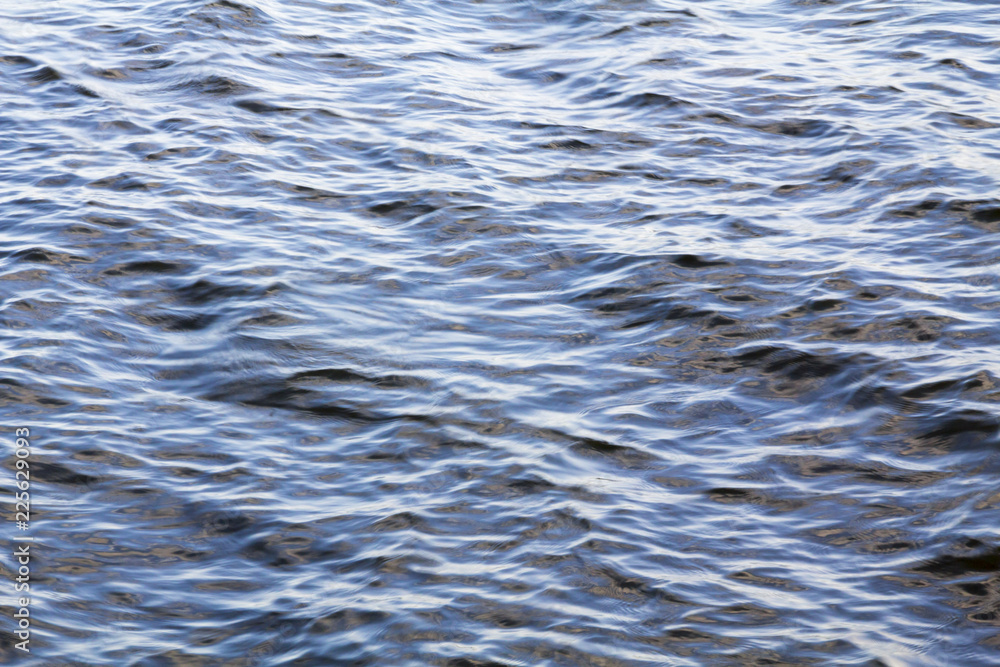 Water surface. Natural background. Ripples on the water surface, blue sea, reservoir
