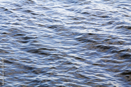 Obraz na płótnie Water surface. Natural background. Ripples on the water surface, blue sea, reservoir w salonie