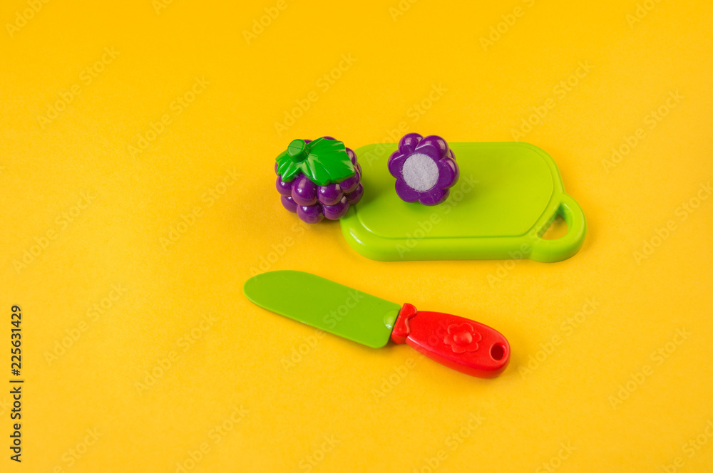 Children's toy plastic fruit in a basket Children's toy plastic fruit in a basket