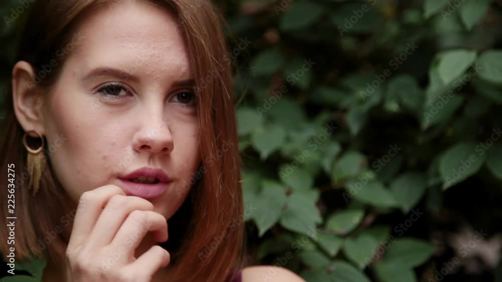 Very beautiful girl stands in bushes and poses. Very beautiful girl stands in bushes and poses.