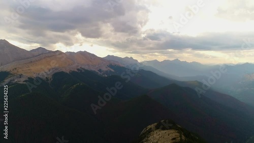 A beautiful Ariel shot of a sunset coming though and aluminating the mountains. photo