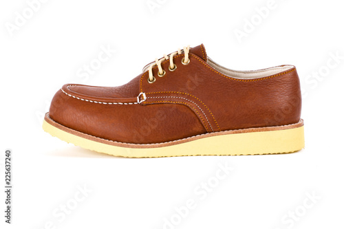 Men's brown shoes isolated on a white background.