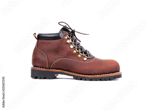 Men's brown boot isolated on a white background. Fashion advertising boot photos.