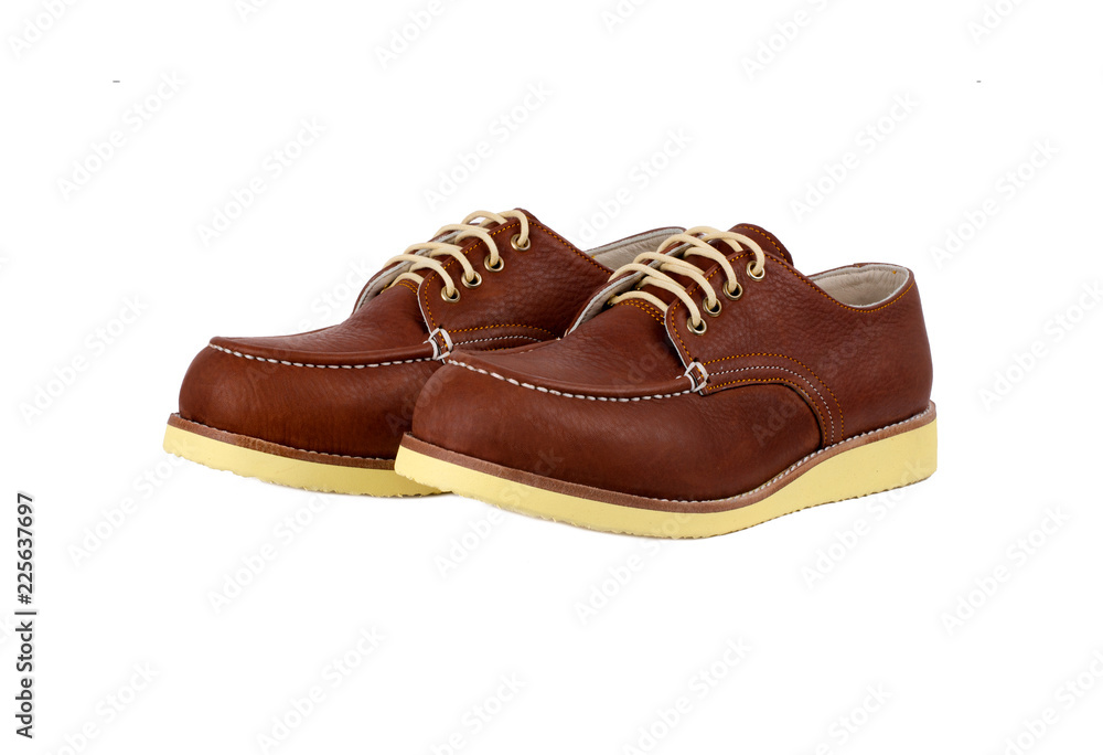 Men’s brown shoes isolated on a white background.