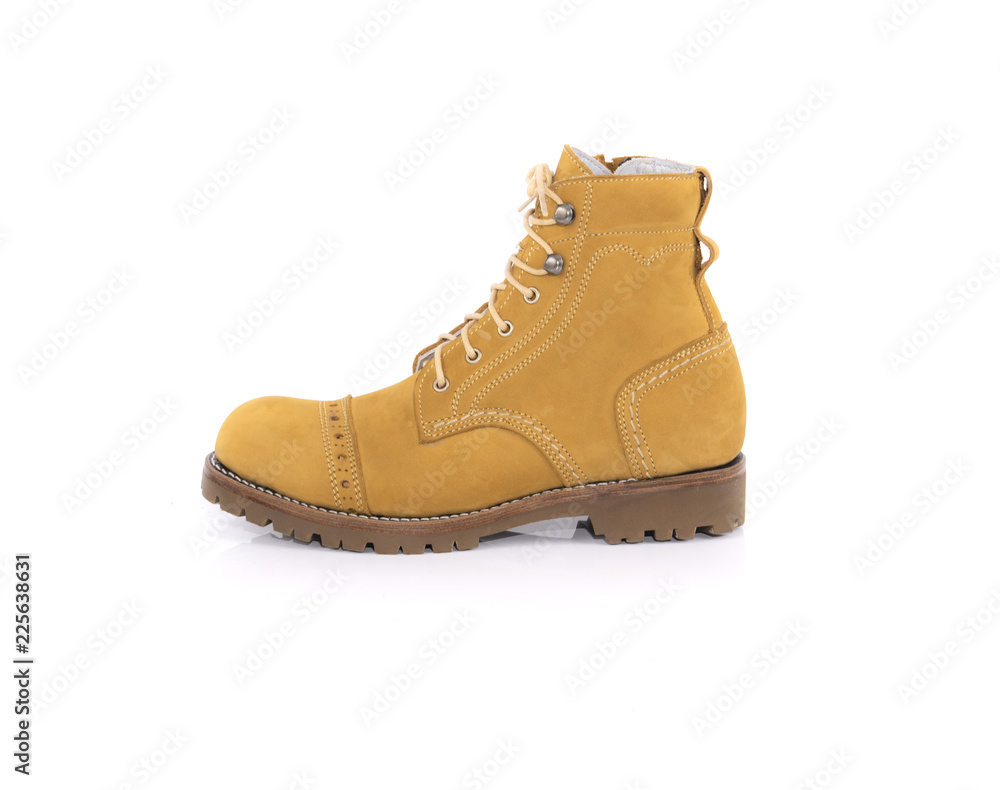 Men’s yellow boot isolated on a white background. Men’s yellow boot isolated on a white background.
