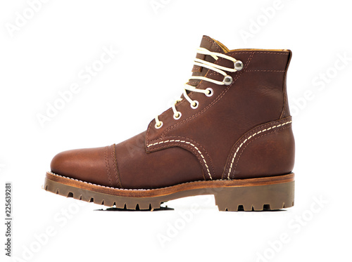 Men’s ankle boot with oilfull grain leather isolated on white background, side veiw , closed up