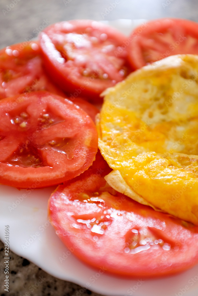 Fresh plain omelette with tomatoes