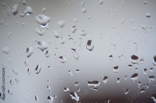 Rain drops or condensation on the glass. It is a cold autumn or winter