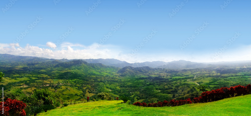 Panoramic view of green plain and agricultural workers. Panoramic view of green plain and agricultural workers.