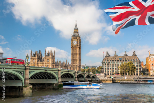 Big Ben and Houses of Parliament with boat in London, UK photo