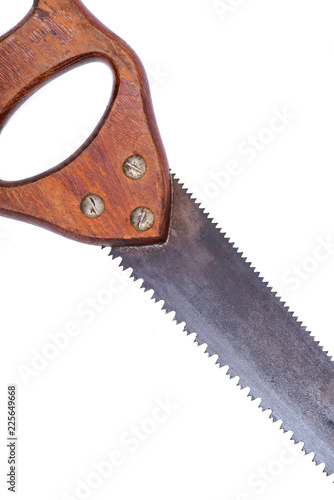 Old fashioned , vintage hand saw with back tuttle tooth isolated on white background photo