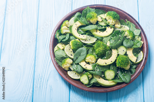 Green baby spinach salad with avocado