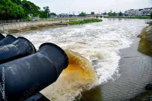 Large water pipe pump flood water and drain, captured with a slow shutter speed.