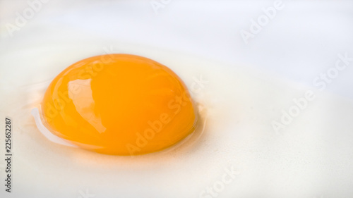 Fresh ragged egg on white plate ready to cook breakfast.