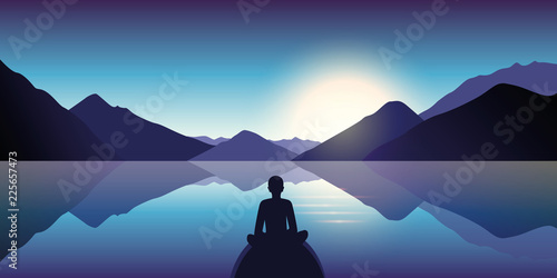person enjoy the silence at lake with mountain view in the dusk
