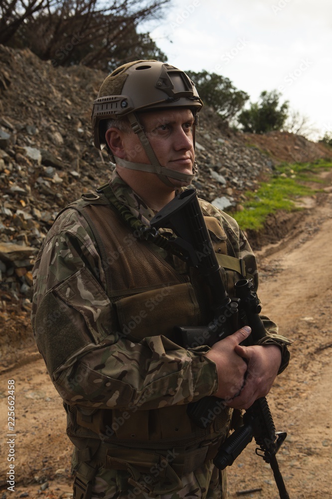 Military soldier standing with rifle during military training Stock ...