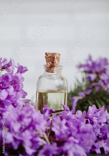 Oil bottle with purple flowers