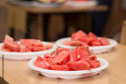 watermelon pieces on a wooden board