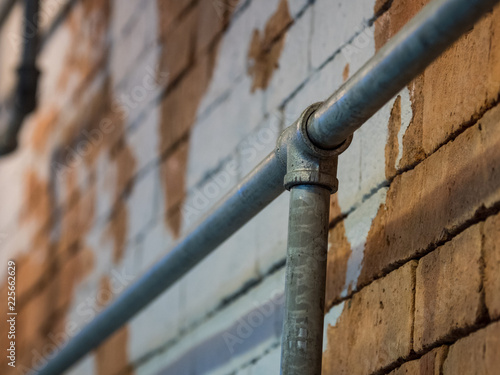 Pipes on a brick wall.