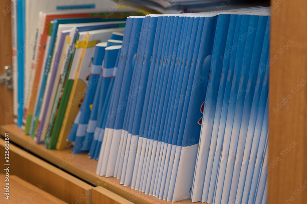 colored magazines on the shelf, educational book colored magazines on the shelf, educational book