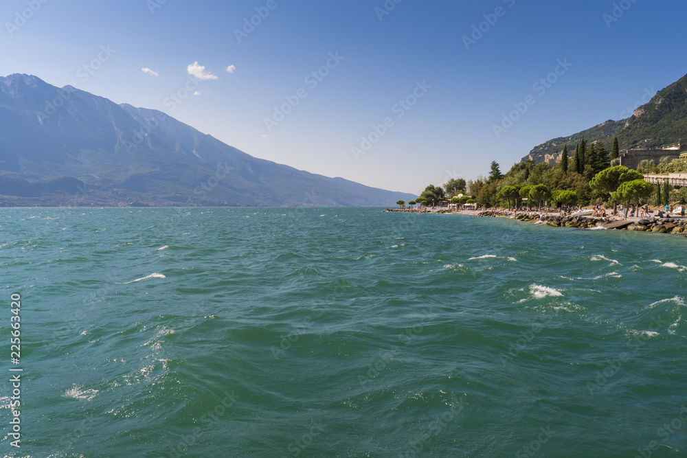 Landscape of Garda lake and the beach of Limone sul Garda, Lombardy region of Italy