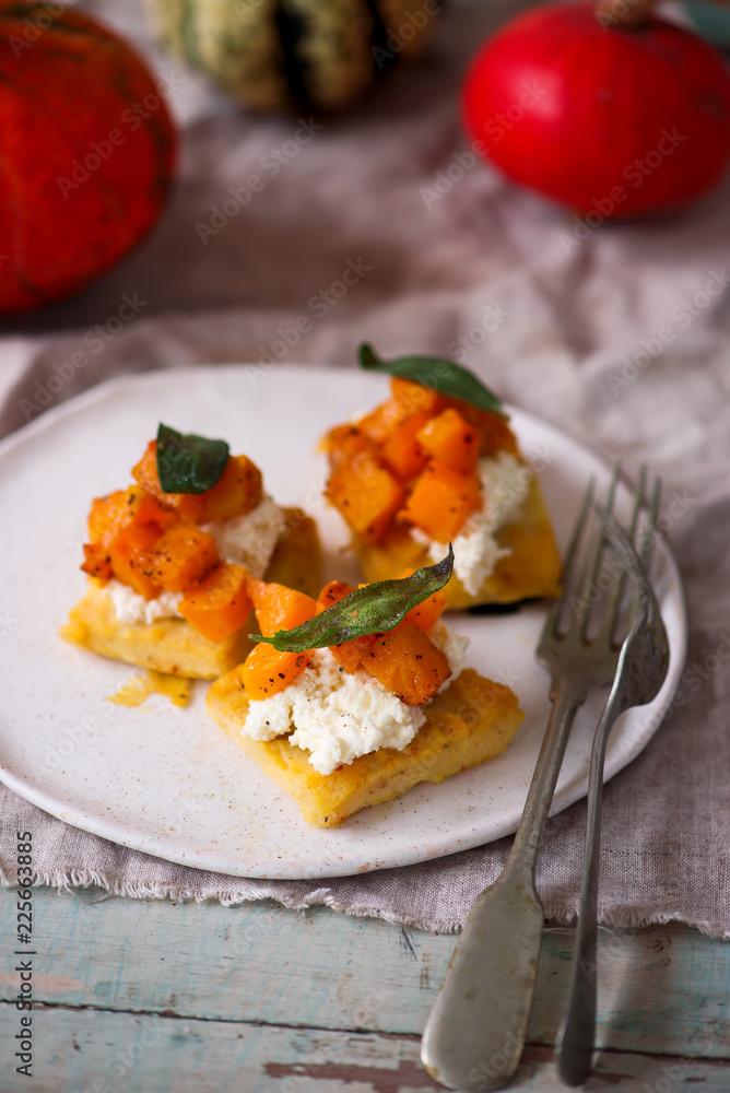 polenta crostini with butternut squash ricotta sage.selective focus polenta crostini with butternut squash ricotta sage.selective focus