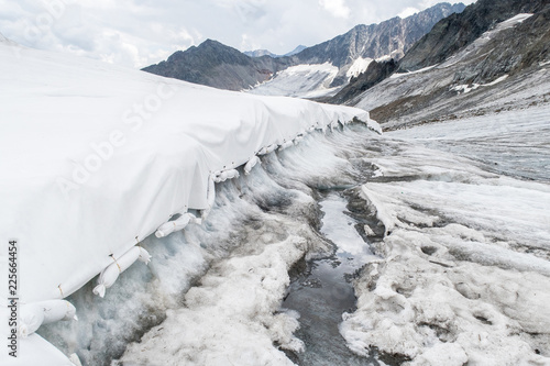 Climate change: Glacier protection with with white blankets at Stubaier Glacier in Austria
