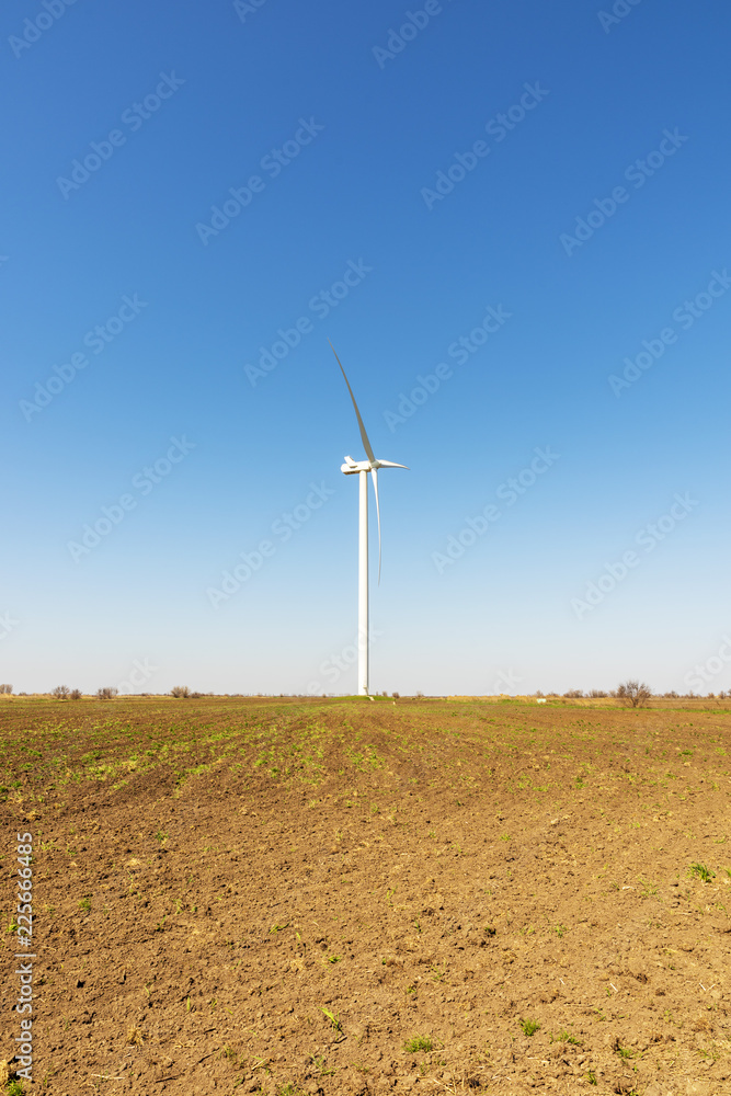 one windmill in a field in spring day, Ukraine one windmill in a field in spring day, Ukraine