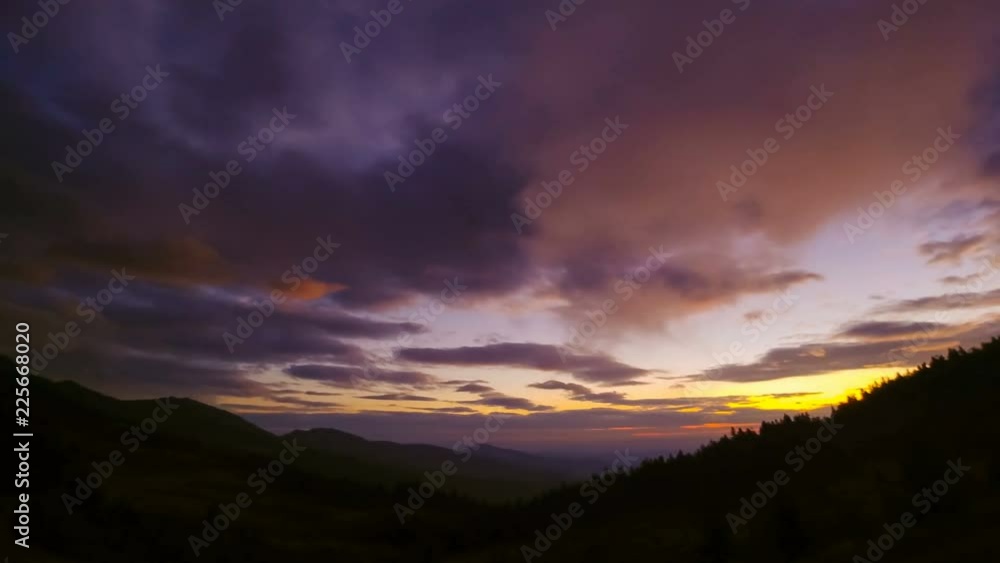 The picturesque mountain with a cloud stream on a sunrise background. time lapse The picturesque mountain with a cloud stream on a sunrise background. time lapse