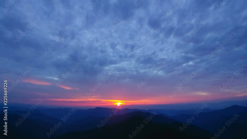 The beautiful mountain sunrise on the cloud stream background. time lapse The beautiful mountain sunrise on the cloud stream background. time lapse