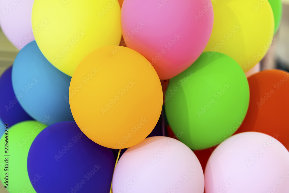 Bright multicolored balloons close-up, festive abstract background for different themes Bright multicolored balloons close-up, festive abstract background for different themes