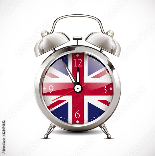 Alarm clock with british flag on clock face - learning concept 