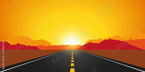 straight asphalt road in autumn at sunrise mountain landscape