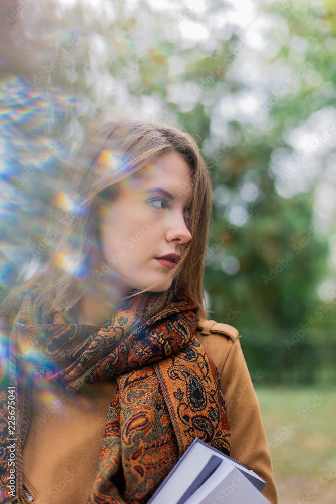 Naklejka premium Portrait of a beautiful girl in the fresh air.
